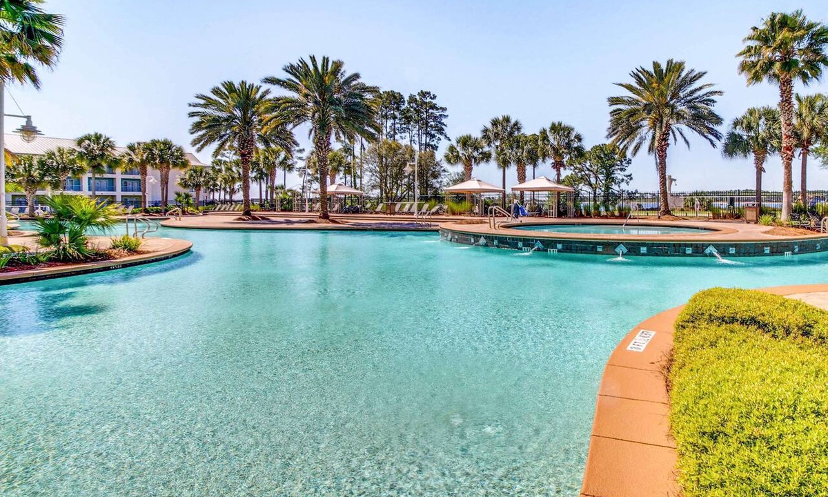 Upper Grand Lagoon Condo | Snowbird-friendly condo with waterfront view, WiFi, AC, access to pool, hot tub