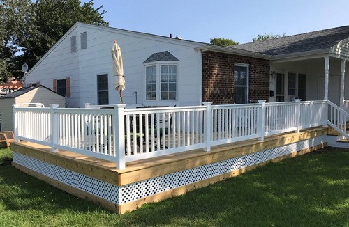 Village Green House | Beautiful corner property with cozy beach vibe.