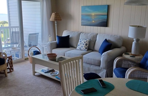 Ocean View Condo | Bethany Bayfront condo directly on the Bay large pool, open area, great Sunsets