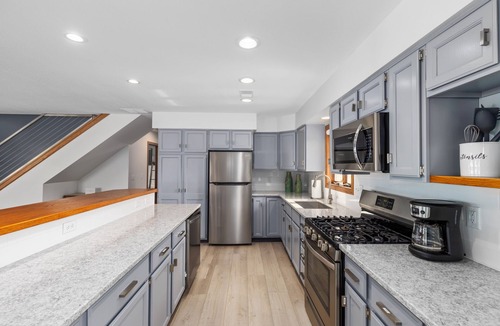 Saugatuck Apartment | Gorgeous Downtown Penthouse with 40' Waterfront Deck Overlooking Kalamazoo River & Mt. Baldhead! 3BR 2BA (Upper Level Unit)
