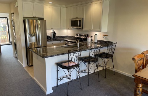 Kihei Condo | Great for families and couples. Next to a tropical pool in Hawaiian landscape.