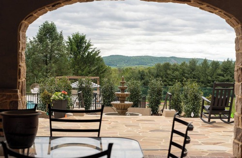 Wernersville House | Overlook Retreat Villa is a luxury private estate on 100 scenic acres for up to 18 guests. Enjoy a pool, hot tub, game room, sports court, and sweeping sunset views that make you stop mid-sentence and create lasting memories!