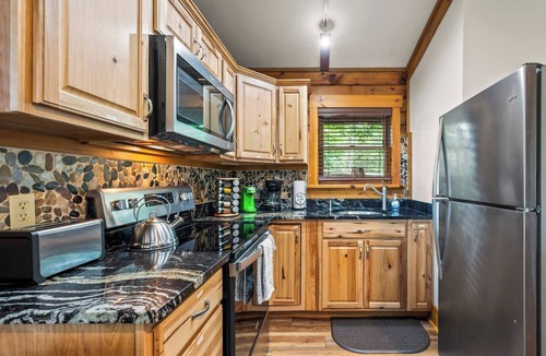 Union Hall Cabin | Plenty of Water on the main channel. Perched on a bluff with breathtaking sunrise views over the lake, this remodeled 2BR/1BA log cabin offers memory-foam beds, well-stocked granite kitchen (farm-fresh eggs!), covered deck, stone fire pit, huge dock.