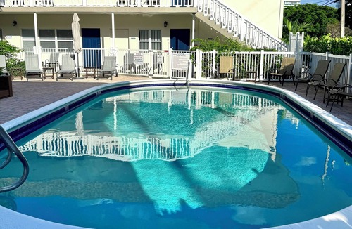 Harbor Village Condo | Relax & Unwind – Walk to the Beach from This 2BR -2BA with Pool and fishing dock