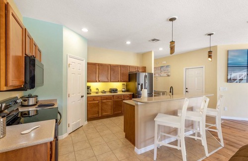 Watersong House | Southfacing heated pool and spa home in Watersong close to Disney attractions