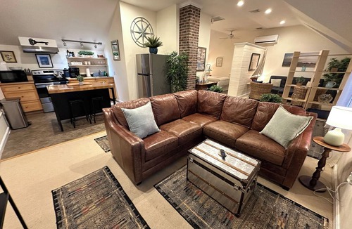 Yachting Village Apartment | Unwind in harbor luxury at this sophisticated studio in Newport's Yachting Village! Cozy queen bed + pull-out sofa bed, fully stocked kitchen, huge deck with sunset harbor views, mini-split AC, TV, off-street parking. Steps to marinas, Thames Street