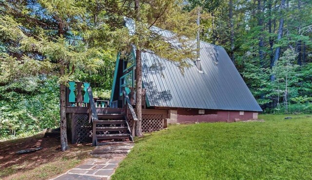 Charming gingerbread A-frame situated on 3 acres, woodstove, A/C, deck