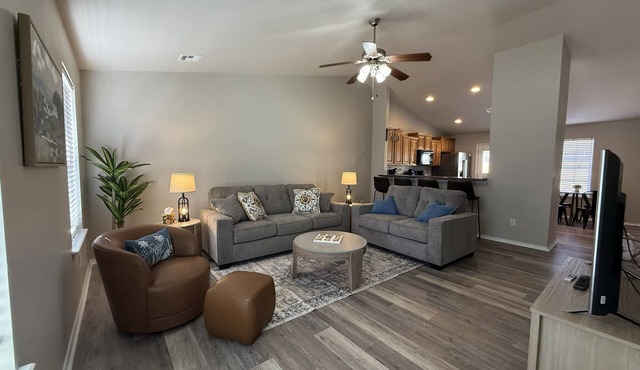 Family-friendly 3BR with a fun 90s themed game room, fenced yard & grill in Broken Arrow