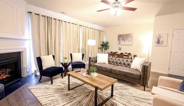 Modern Walnut House: Comfort King Bed PS4 Work Desk TVs RTP RDU