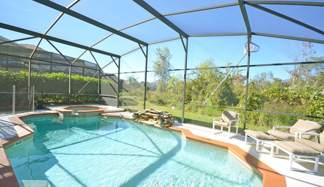 Private pool with waterfall feature. Popular 4 bed, 3 bath villa in Windwood Bay