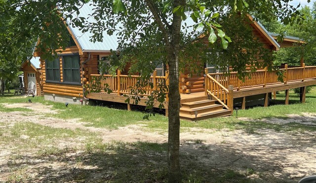Rustic and Elegant Creekside Log Cabin in Wing