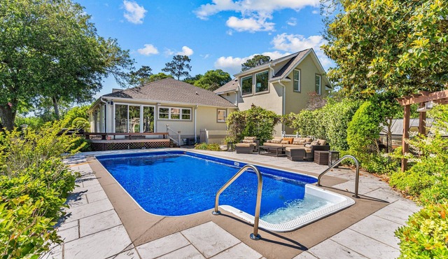 Shining Waters: Gorgeous waterfront home with private hot tub, pool, views, deck, & fireplace